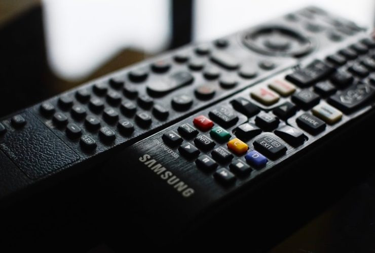 Detailed close-up of a Samsung remote control showcasing buttons and logo.