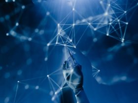 A robotic hand reaching into a digital network on a blue background, symbolizing AI technology.