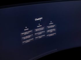 Close-up of a computer screen displaying ChatGPT interface in a dark setting.