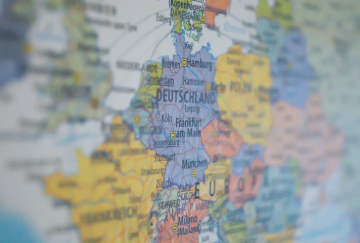 Close-up view of Germany on a colorful world map showing major cities.